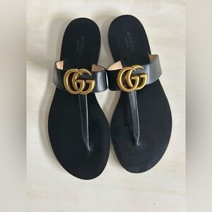 Gucci Marmont Black Leather sandals, enhanced with gold GG logo. Womens size 40.